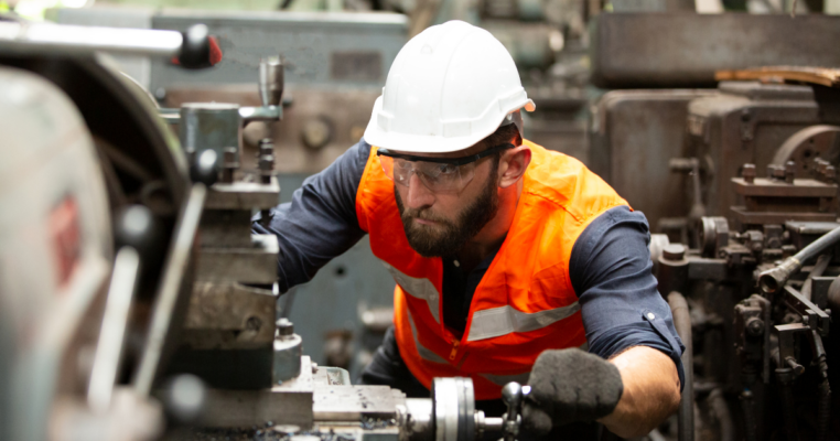 Man working on machinery in a manufacturing plant